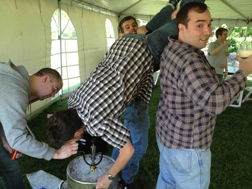 The groom enjoys a pre-wedding beer...